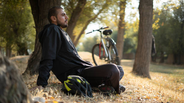 Person reflecting on mood after a cycling session outdoors